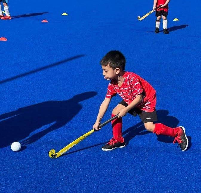 Kids' field hockey group class