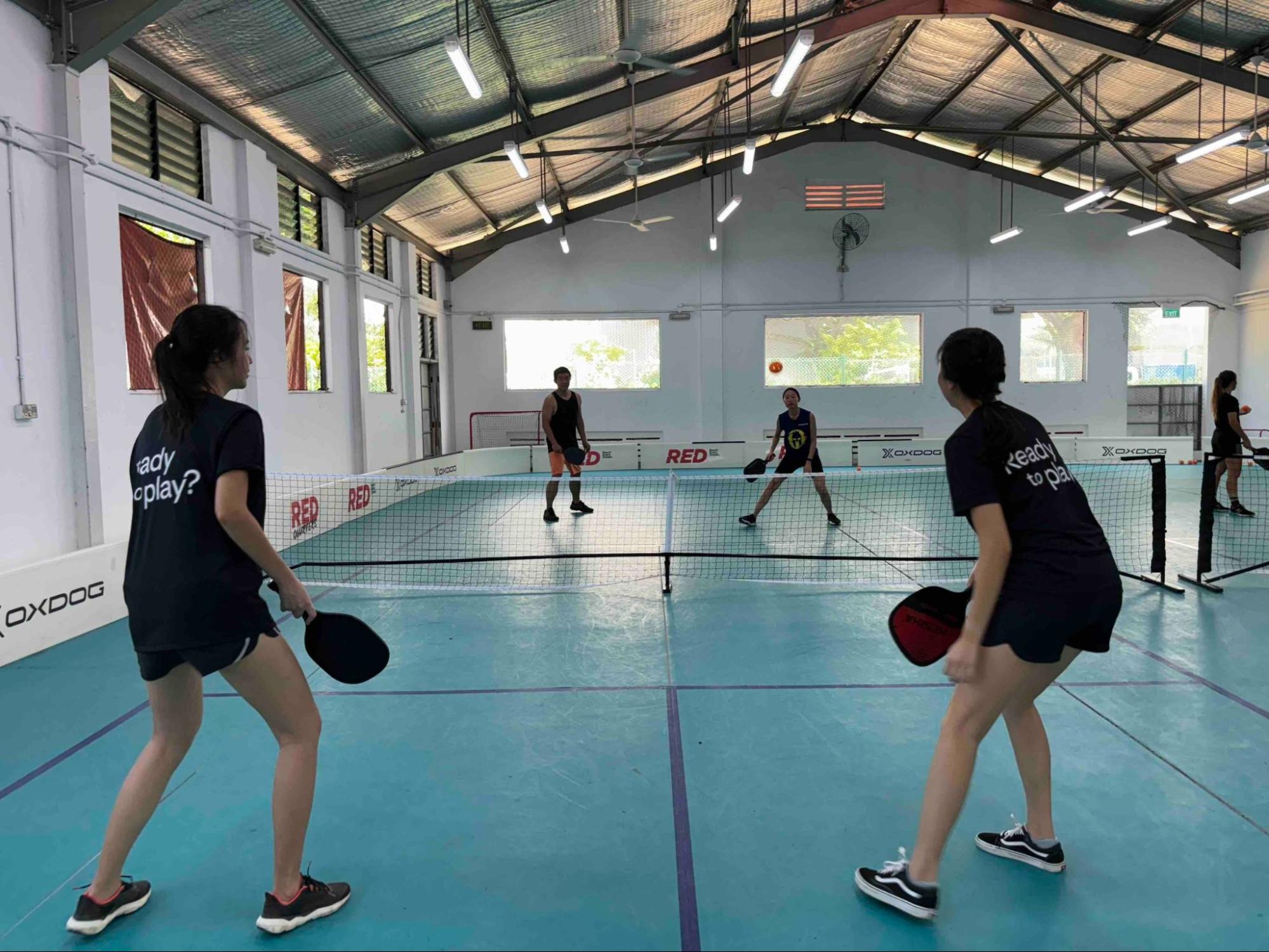 Pickleball group class on indoor court